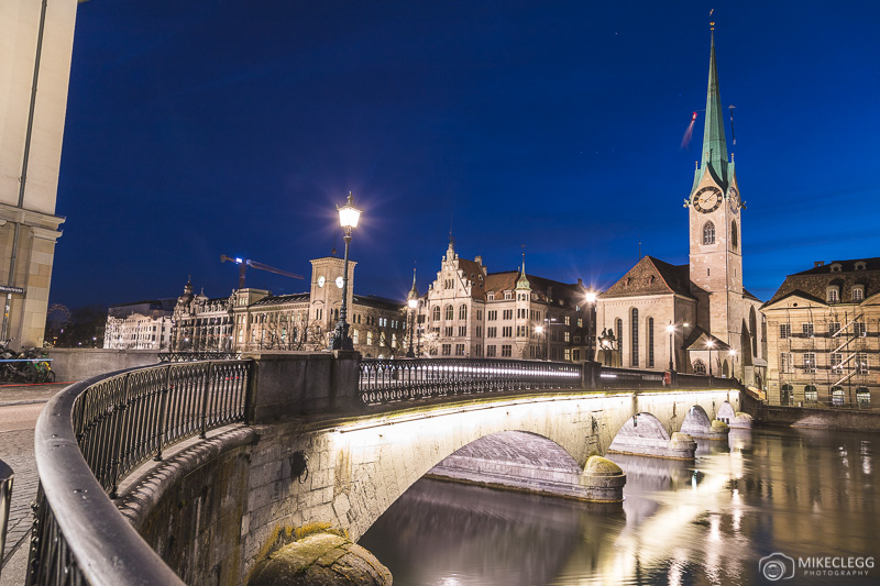 View over Münsterbrücke towards Fraumünster Church at night