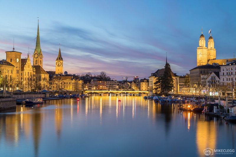 Travelling on a Budget: How to Visit Zurich Views from Quaibrücke at sunset-blue hour