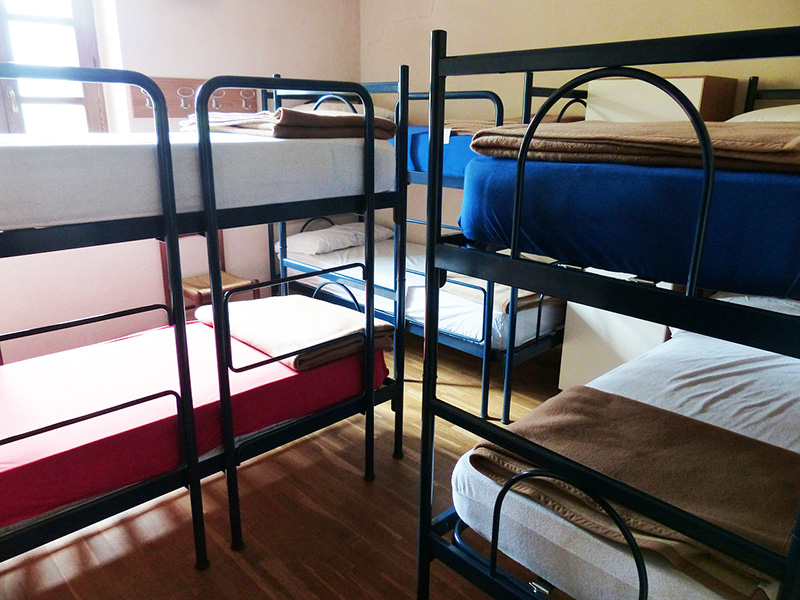 Beds in a hostel dorm - CC0 (Pixabay)