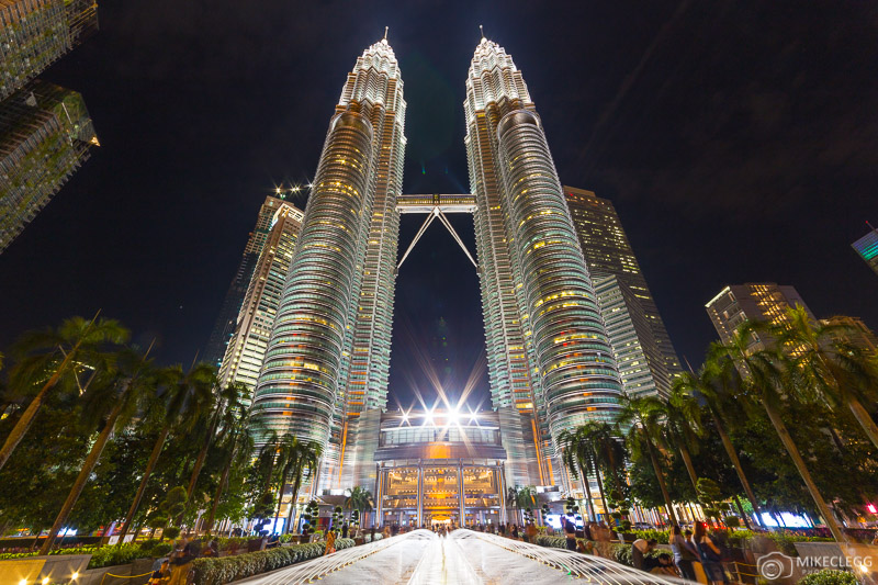 Front of Petronas Towers at night in Kuala Lumpur