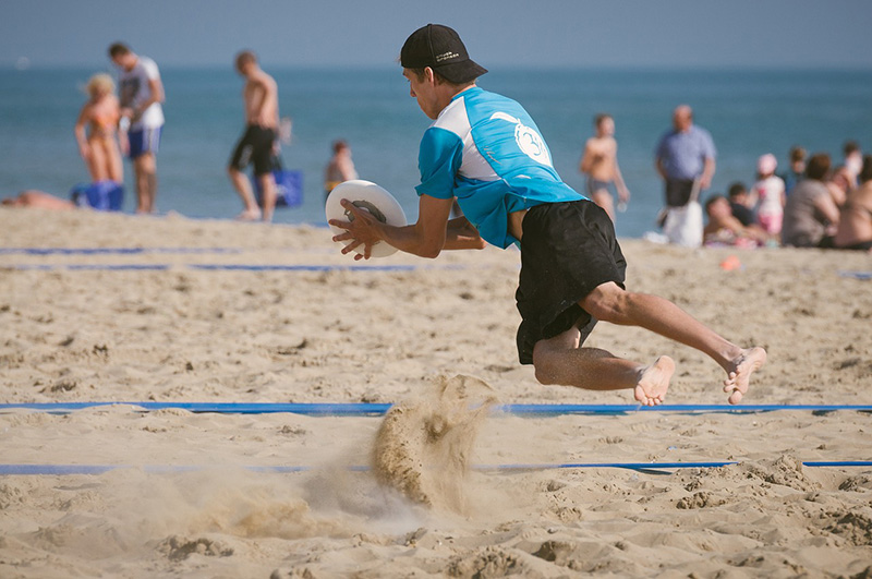 Playing frisbee on a beach