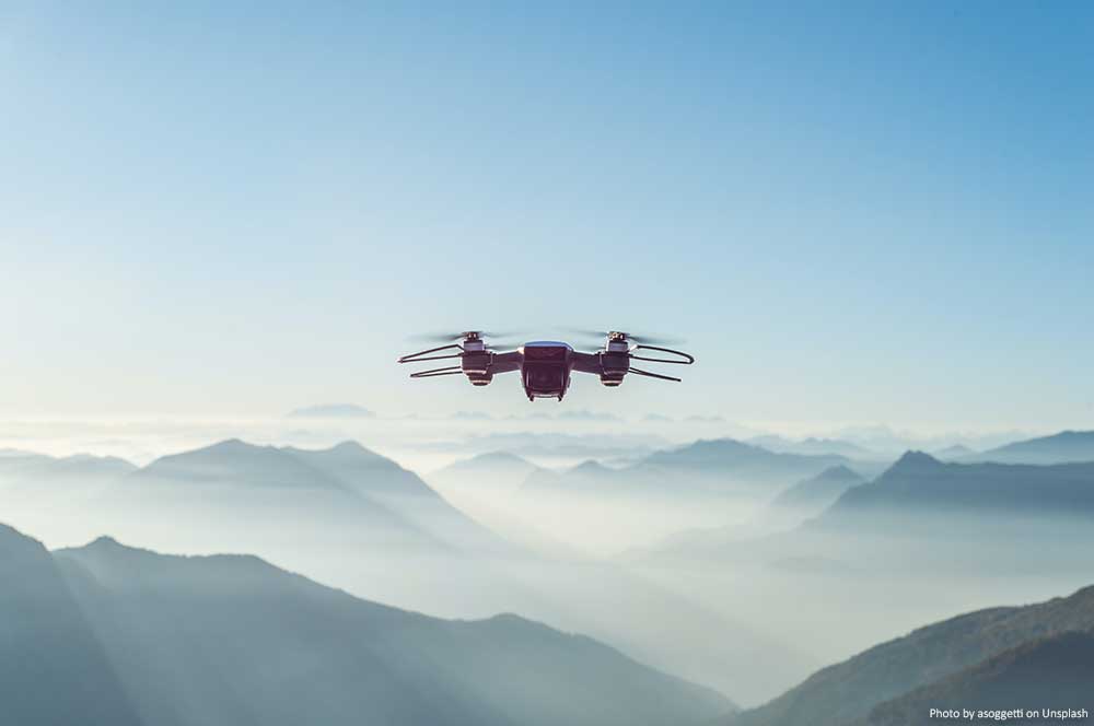 Should You Buy a Drone? (Pros and Cons) Drone and Mountains
