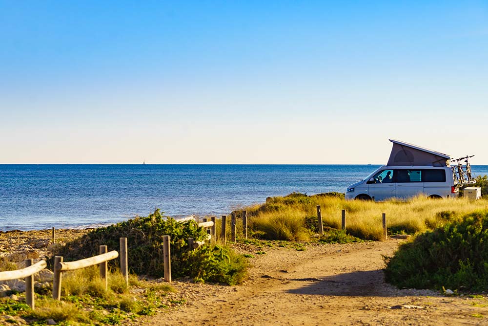 Camper van setup with views of the sea