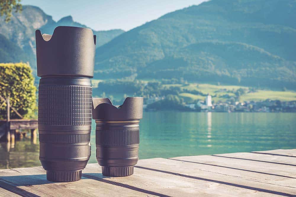 Camera lenses outside by a lake